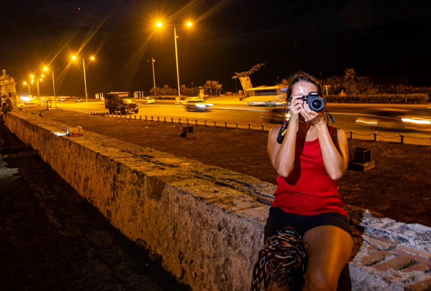 A women learning night and light photo techniques