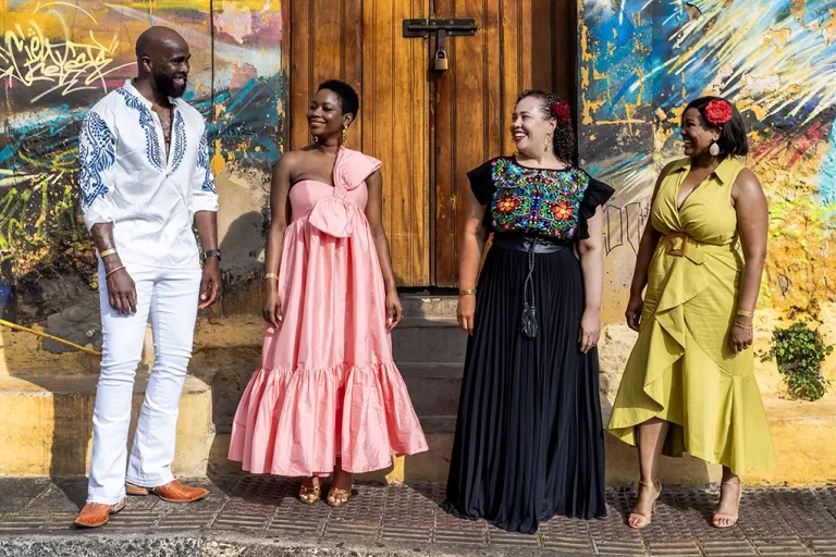 Four friends enjoying a local photo session in the colorful streets of Getsemani, Cartagena Colombia