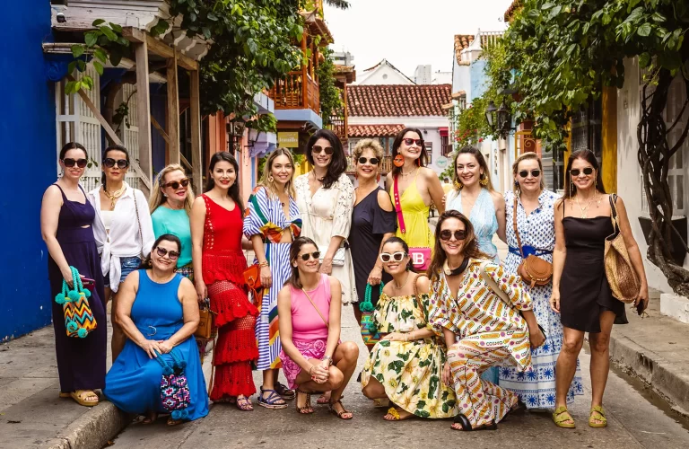 A group of women exploring Cartagena de Indias in a luxury travel retreat followed by a local Photographer